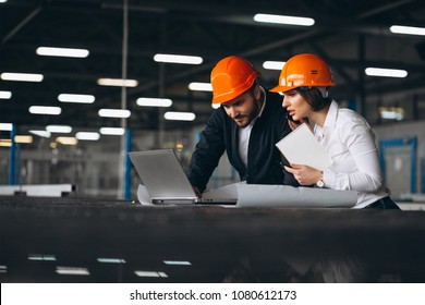 Man And Woman At A Factory