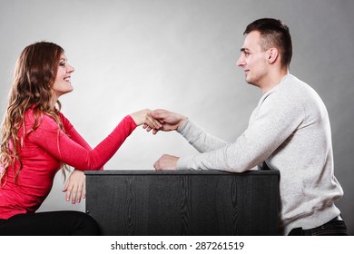 Man And Woman First Date Meeting. Handshake Greeting. Male And Female Shaking Hands And Getting To Know Each Other. 