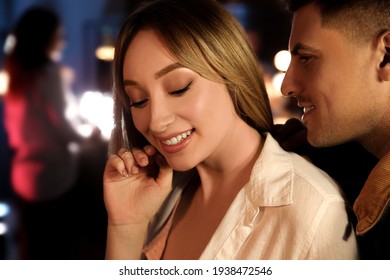 Man And Woman Flirting With Each Other In Bar