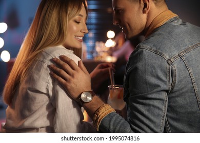 Man And Woman Flirting With Each Other In Bar, Closeup