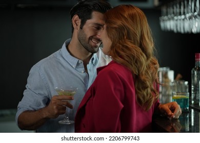 Man and woman flirting with each other in bar At Evening Party. Romantic couple dating at night in pub. couple dating , propose marriage. Romantic couple on a date sitting in a restaurant. 