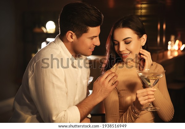 Man and woman
flirting with each other in
bar