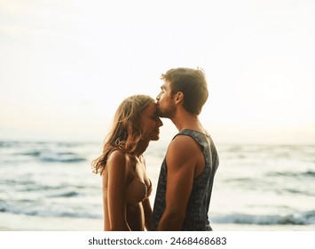 Man, woman and forehead kiss at beach for love, travel and vacation in nature for summer sunset. Happy, couple and holiday with sunshine, smile and people together for date on island in Thailand - Powered by Shutterstock