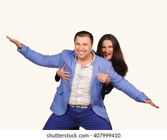 Man and woman with funny faces isolated over white background - Shutterstock ID 407999410