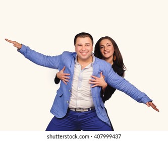 Man and woman with funny faces isolated over white background - Shutterstock ID 407999437