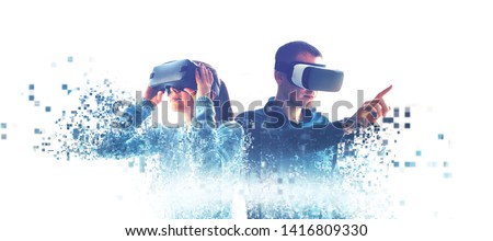 A man and a woman in glasses of virtual reality. The concept of modern technologies and technologies of the future. Fragmented by pixels. VR glasses.