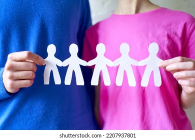 Man And Woman Hands Holding Paper Family Close Up