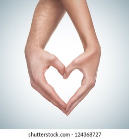 man   woman hands show heart gesture isolated blue gradient background