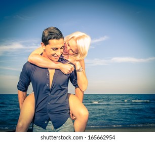 Man And Woman Having Fun On The Beach