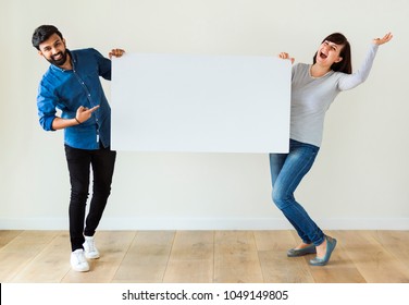 Man And Woman Holding Blank Board Copyspace