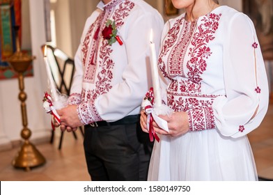 Man And Woman Holding Candle In The Hand