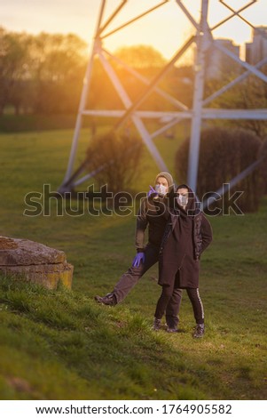 Similar – happy twin sisters stand on a bridge and look up