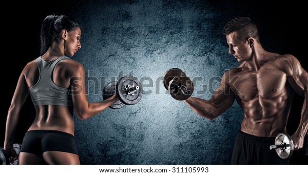 Man and woman\
isolated on a dark\
background