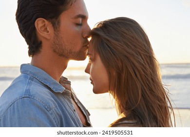 Man, woman and kiss forehead at beach at holiday vacation for support relationship, trust or love. Happy couple, embrace and hug at ocean water for peace journey at coast for relax, trip or sunset - Powered by Shutterstock