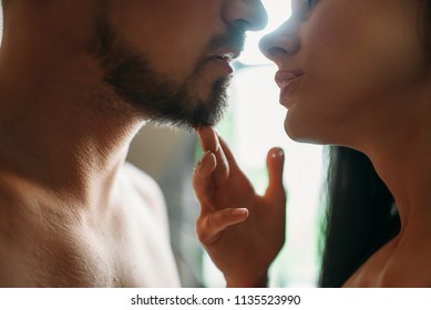 Man And Woman Kissing Against A Window, Erotica