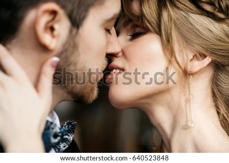Similar – Image, Stock Photo Woman kissing man from side in sunset