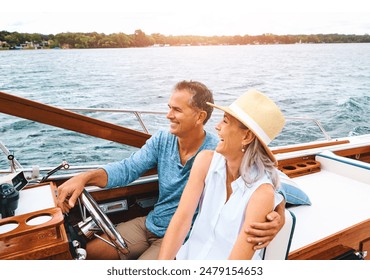 Man, woman and lake adventure with travel in boat on holiday, relax on cruise date for retirement together. Mature, happy couple and driving on water yacht for vacation with happiness, summer in Bali - Powered by Shutterstock