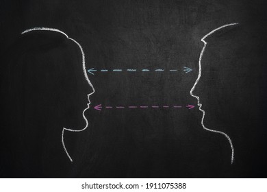 Man And Woman Looking At Each Other Drawing On Chalk Board