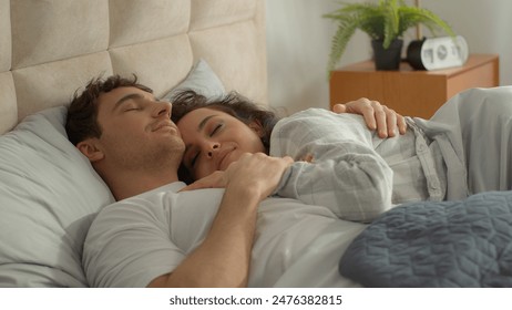 Man woman lying on bed boyfriend girlfriend bedroom domestic comfortable cozy rest relaxing happy couple hugging embrace cuddle harmony tenderness love weekend pair affectionate beloved daydream sleep - Powered by Shutterstock