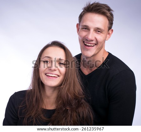 Man and woman making faces in studio