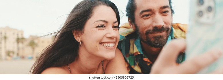 Man and woman making video call using mobile phone on the beach, panorama - Powered by Shutterstock