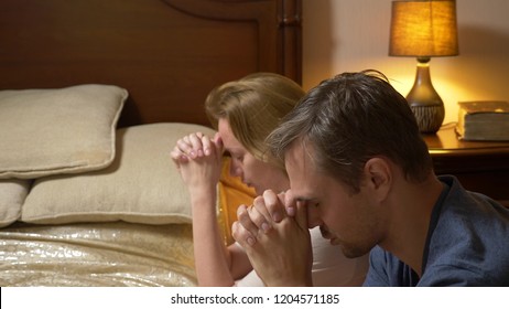 A Man And A Woman, A Married Couple Praying Before Going To Bed