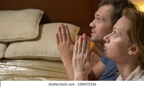 A Man And A Woman, A Married Couple Praying Before Going To Bed