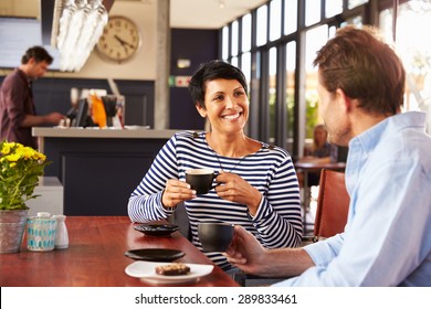 Man And Woman Meeting Over Coffee In A Restaurant