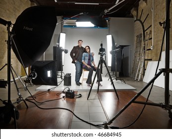 Man And Woman In A Modern Photo Studio