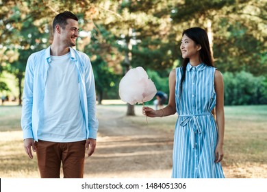 Man And Woman Nature Friendship Fun Eating Candy Floss