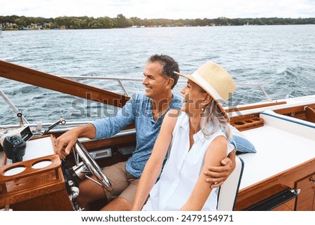 Man, woman and ocean adventure or together in boat on holiday, relax on cruise date for retirement travel. Mature, happy couple and water yacht for vacation with happiness, outdoor summer in Bali