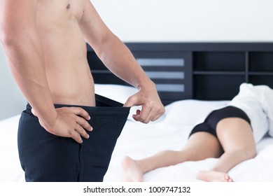 Man And Woman On Bed, Unhappy Young Couple On The Bed In Bedroom, Family Concept.