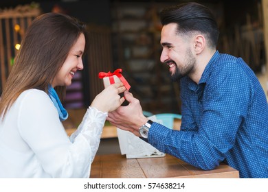 Man Woman On Date Holding Present Stock Photo 574638214 | Shutterstock