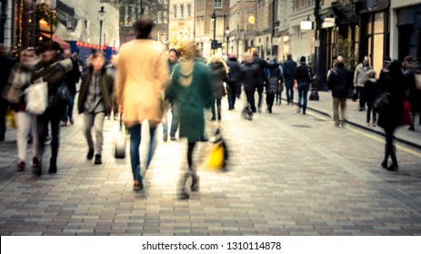 Man & Woman On High Street Shopping Scene
