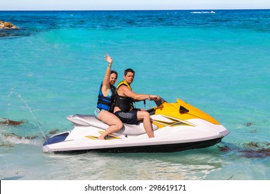 Man And Woman On A Jet Ski