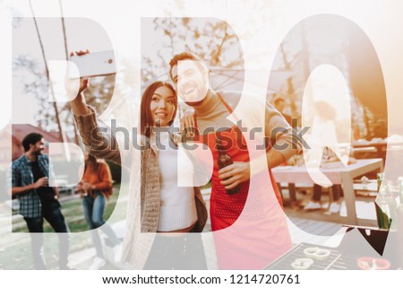 Man And Woman Outside Barbecue Selfie Making. Smoked Food. Nature Activity. Outside Relaxing Activity Concept. Smiling Friends Are Having Fun. Resting Together. Sunny Day. Sweater Weather.