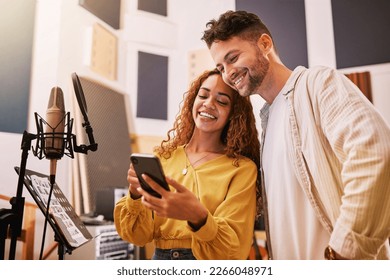 Man, woman or phone in recording studio for song lyrics, podcast ideas or album cover art in production booth. Smile, happy or musician on mobile technology for friends, singer or media collaboration - Powered by Shutterstock