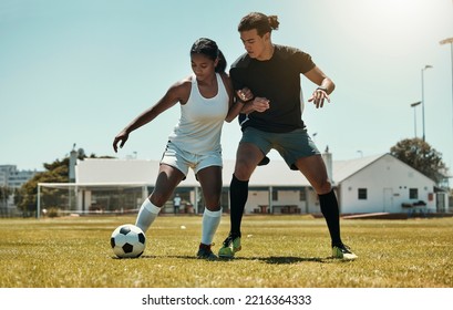 Man, woman and playing soccer on grass park, stadium field and nature environment in competition match, game and challenge. Fitness friends, sports people and football players in soccer ball training - Powered by Shutterstock