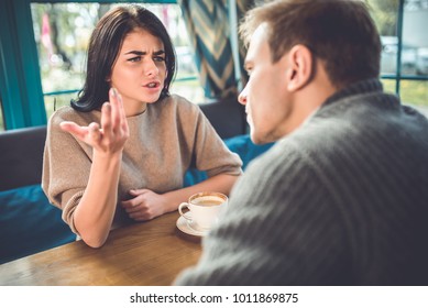The man and woman quarreling in the restaurant - Powered by Shutterstock