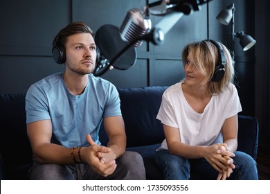 Man And Woman Recording Podcast Or Interview In The Cosy Studio