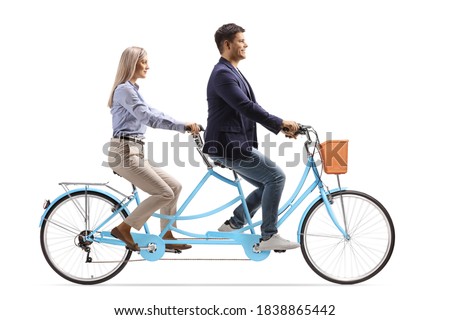 Man and woman riding a tandem bicycle together isolated on white background
