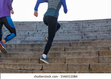 Man and woman run on the stairs in the morning