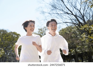 Man and woman running side by side - Powered by Shutterstock