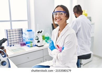 Man and woman scientist partners smiling confident working at laboratory - Powered by Shutterstock