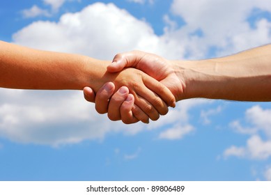 A man and woman shaking hands
