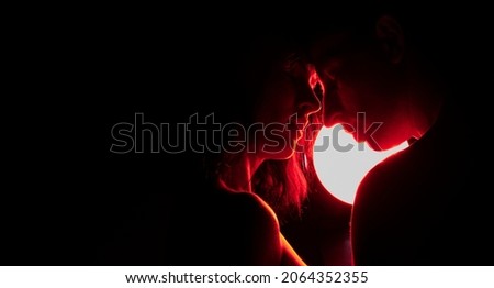 Man and woman. Silhouettes on a black background. Couple in love.