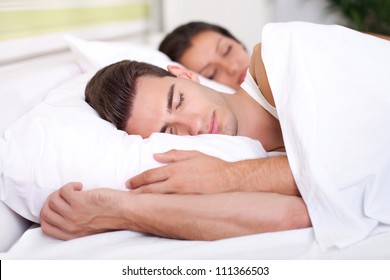 Man and woman sleeping