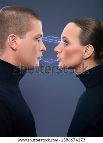 Similar – Man and woman face each other