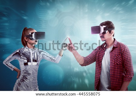 Man and woman touching with finger inside cyber world. Virtual reality concept