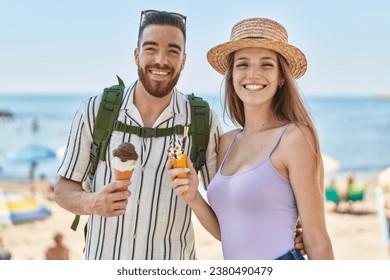 Man and woman tourist couple smiling confident eating ice cream at seaside - Powered by Shutterstock